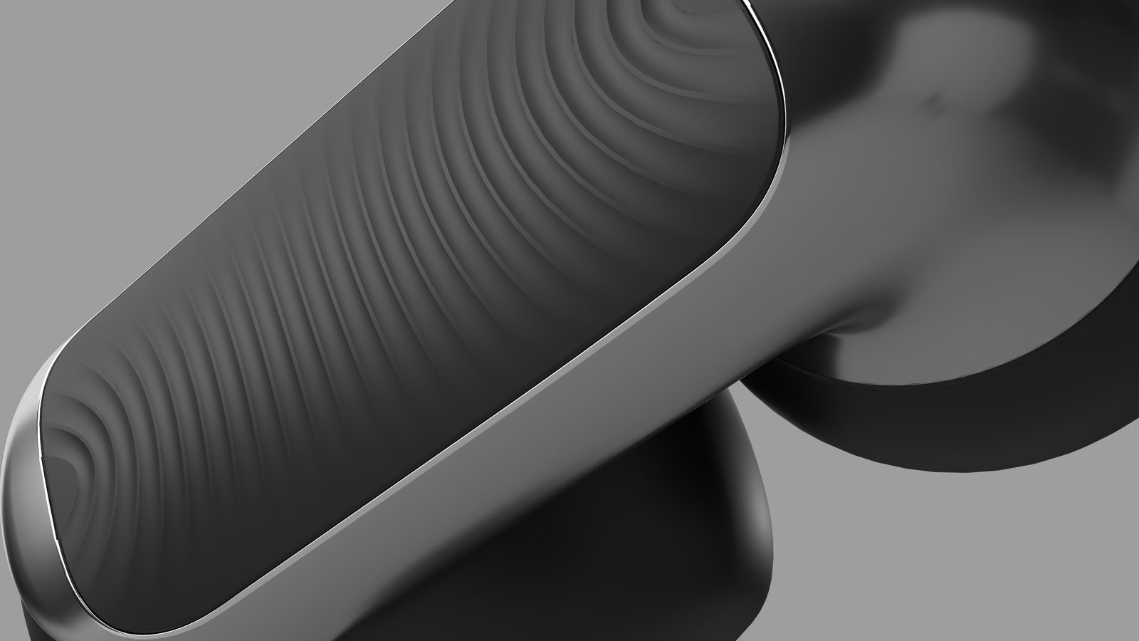 Macro of a rippled touch surface on a black earbud