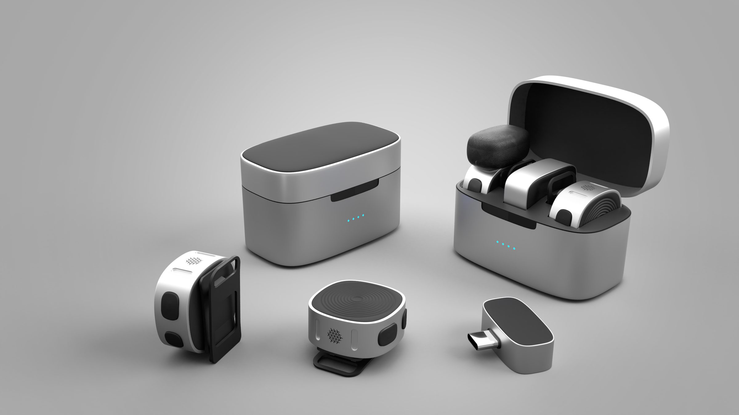 Wireless microphone kit: two clip-on transmitters, a USB-C receiver and a two-tone charging case