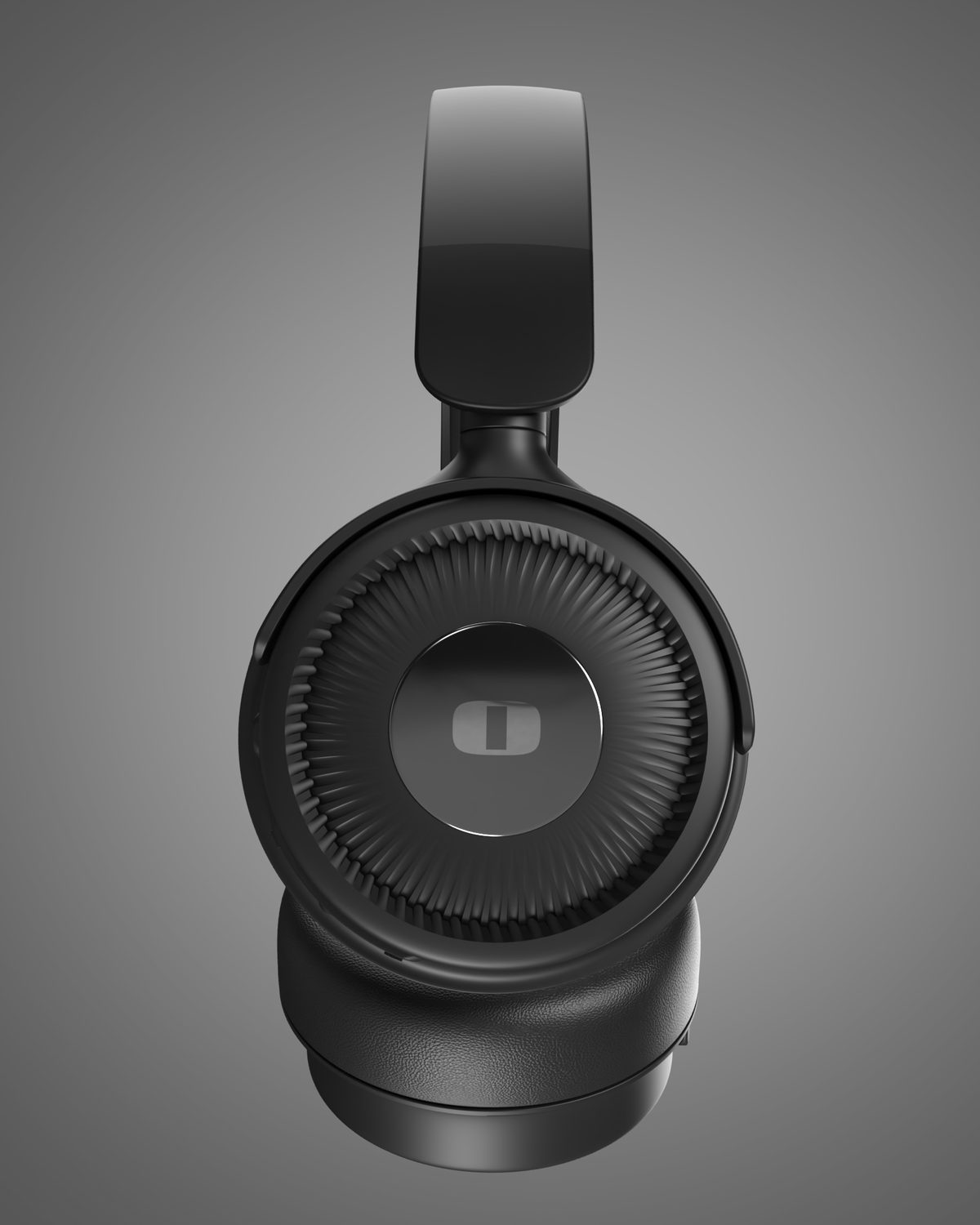 Side profile of black foldable headphones showing radial fins around the centre badge